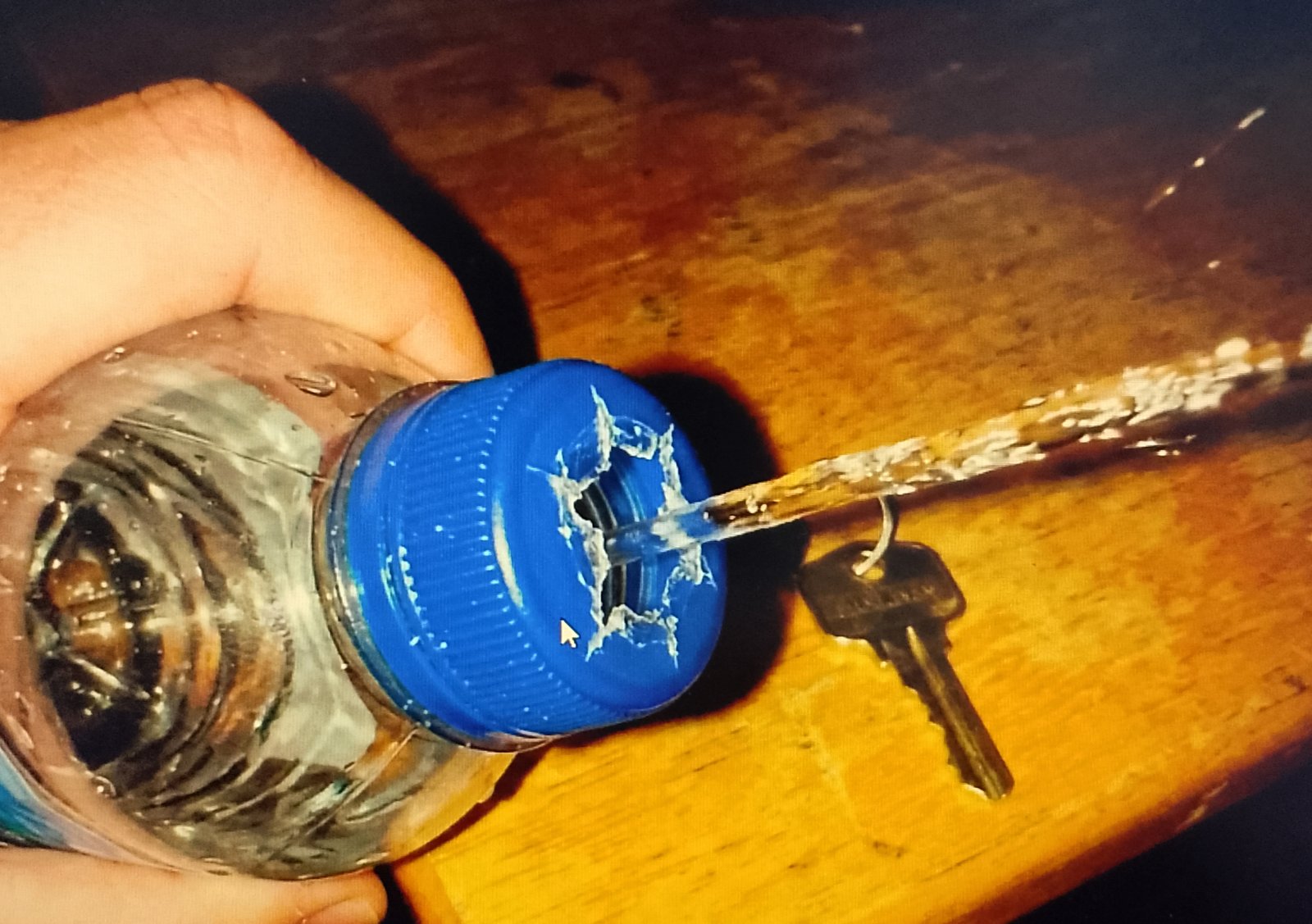 bottle cap Water bottle cap with a hole poked in it for a DIY bidet