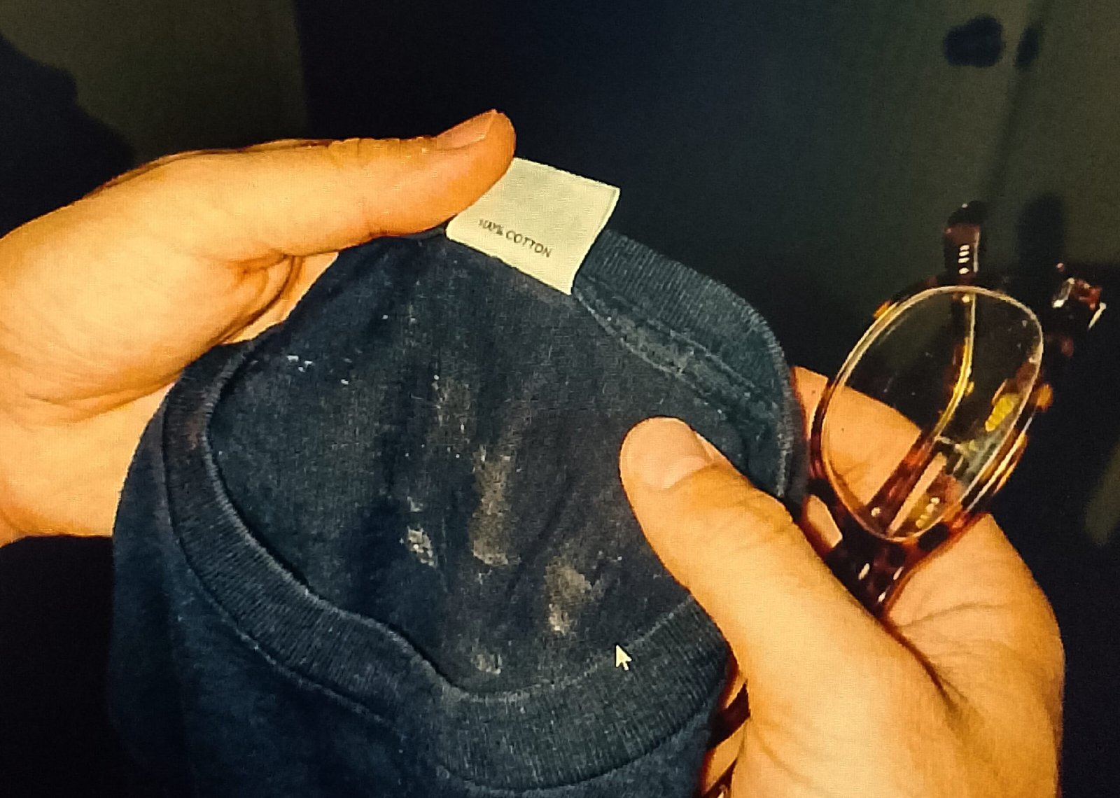 Checking shirt tag for cotton percentage before using it on glasses