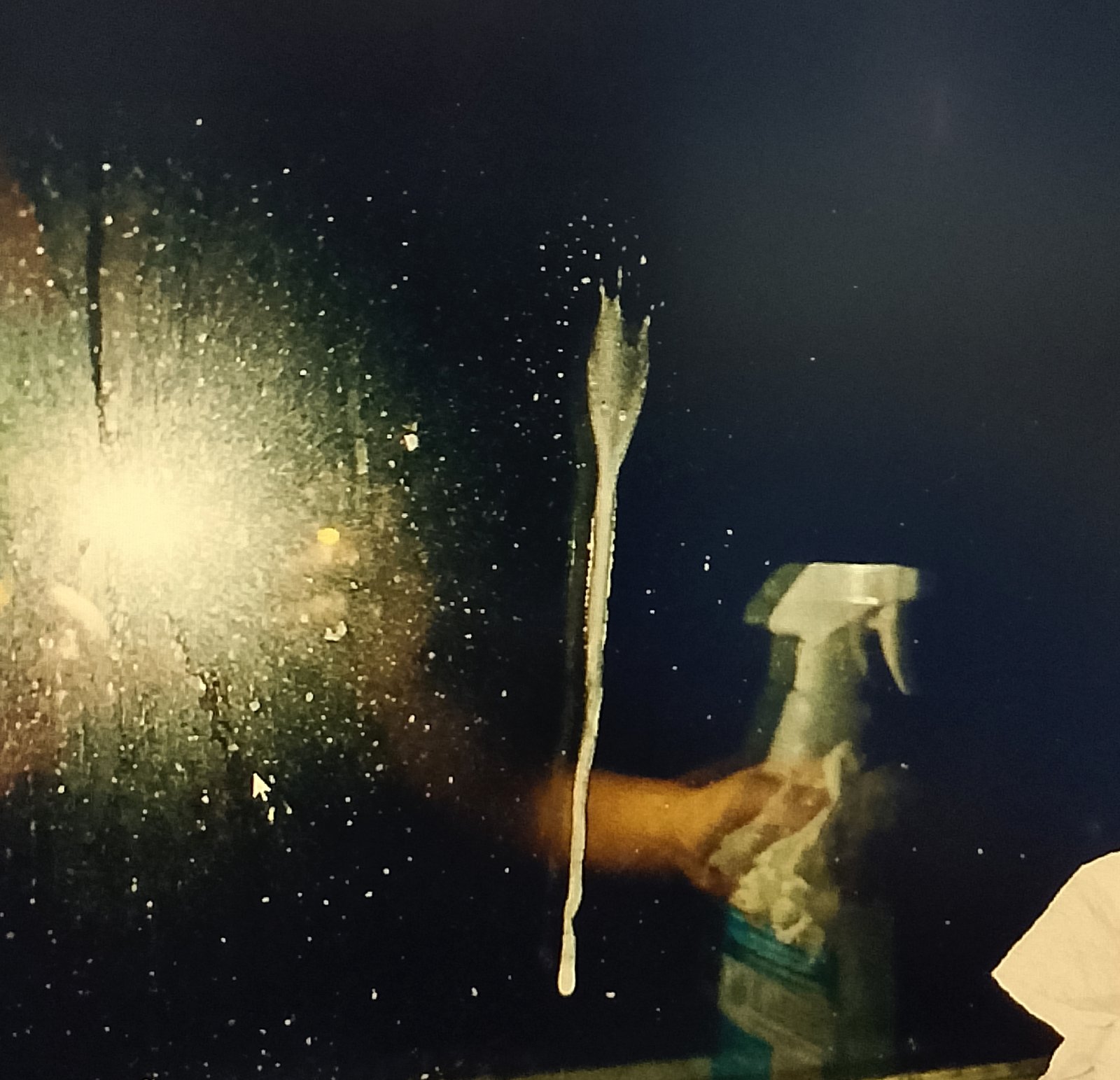 drip line slide down window Cleaning solution dripping down a window pane