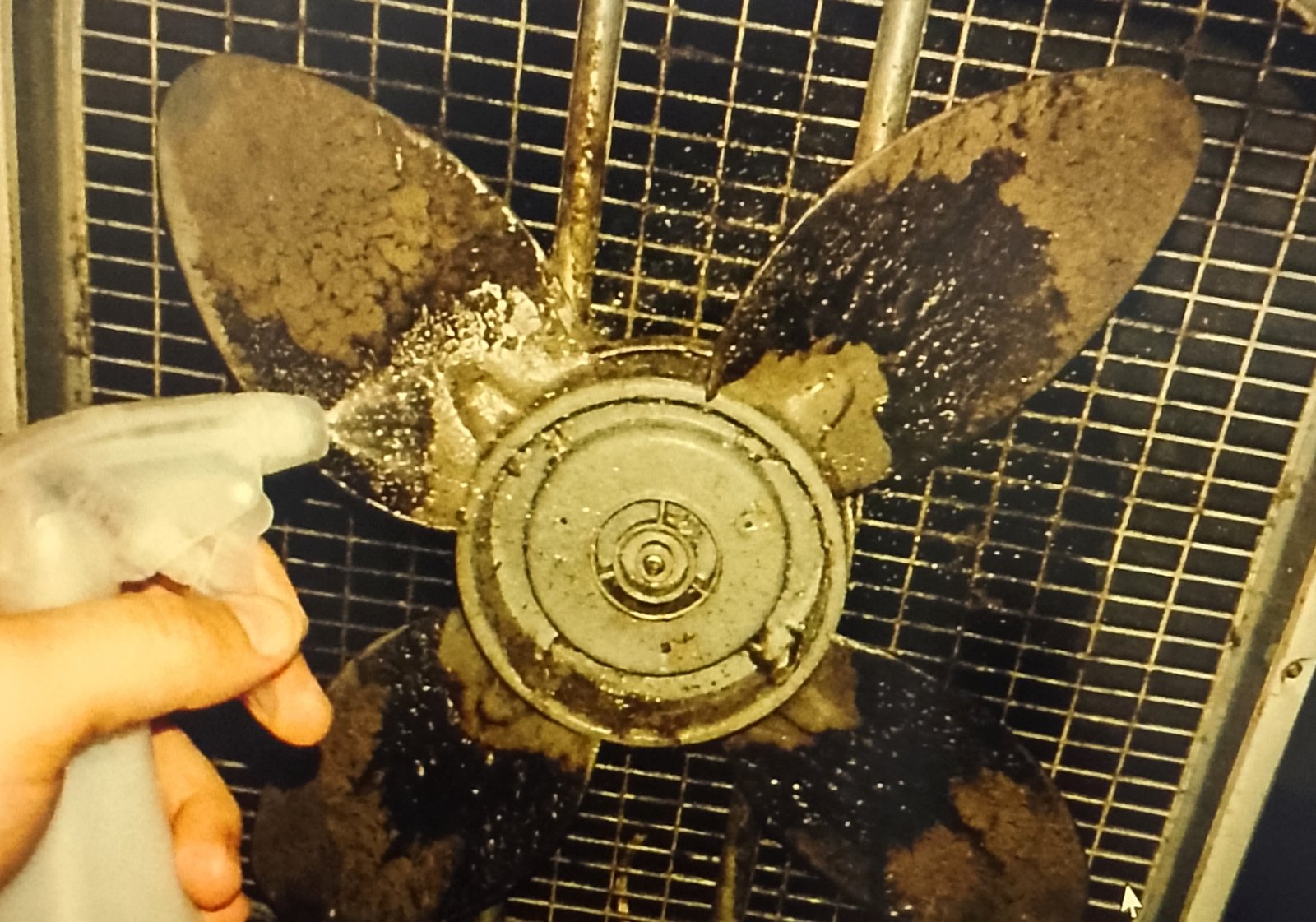 fan cage Spraying solution onto fan blades