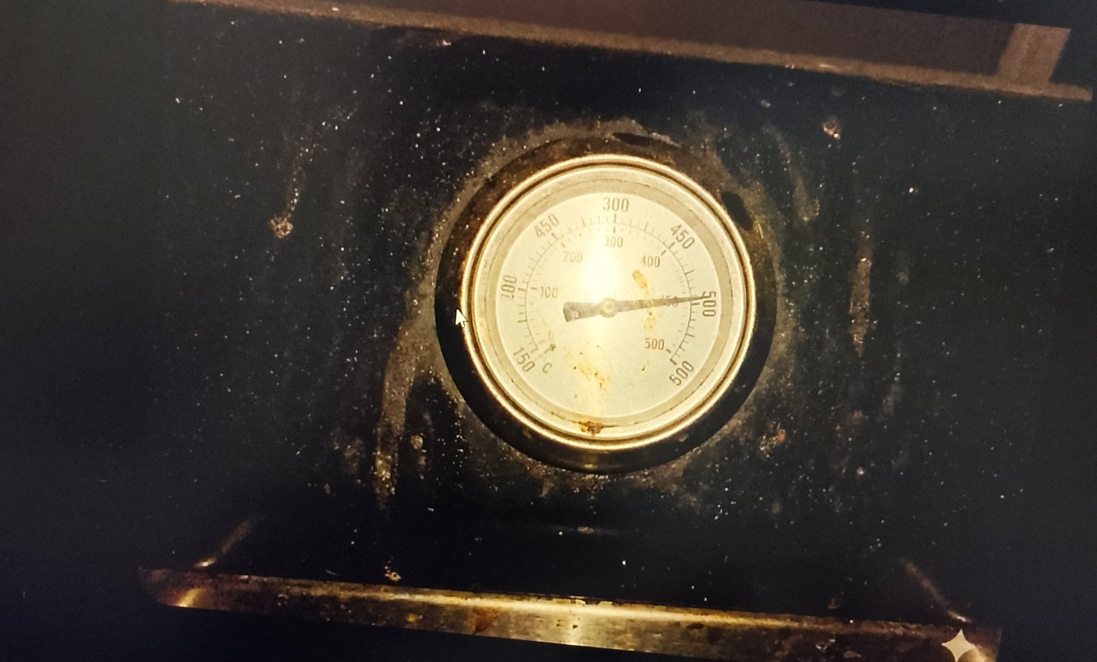 Grill thermometer showing high heat
