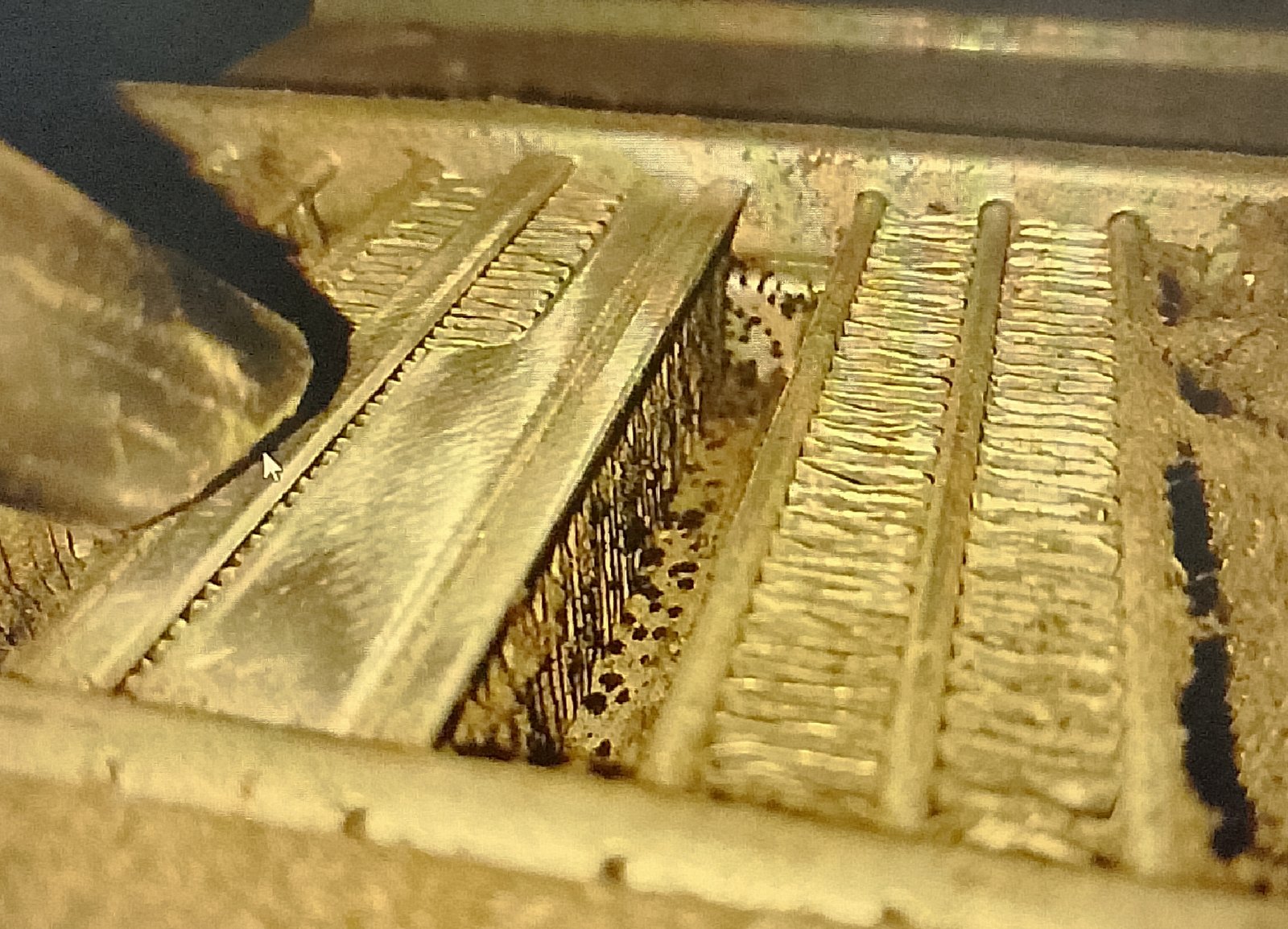 metal plates Vacuuming aluminum fins on window AC unit