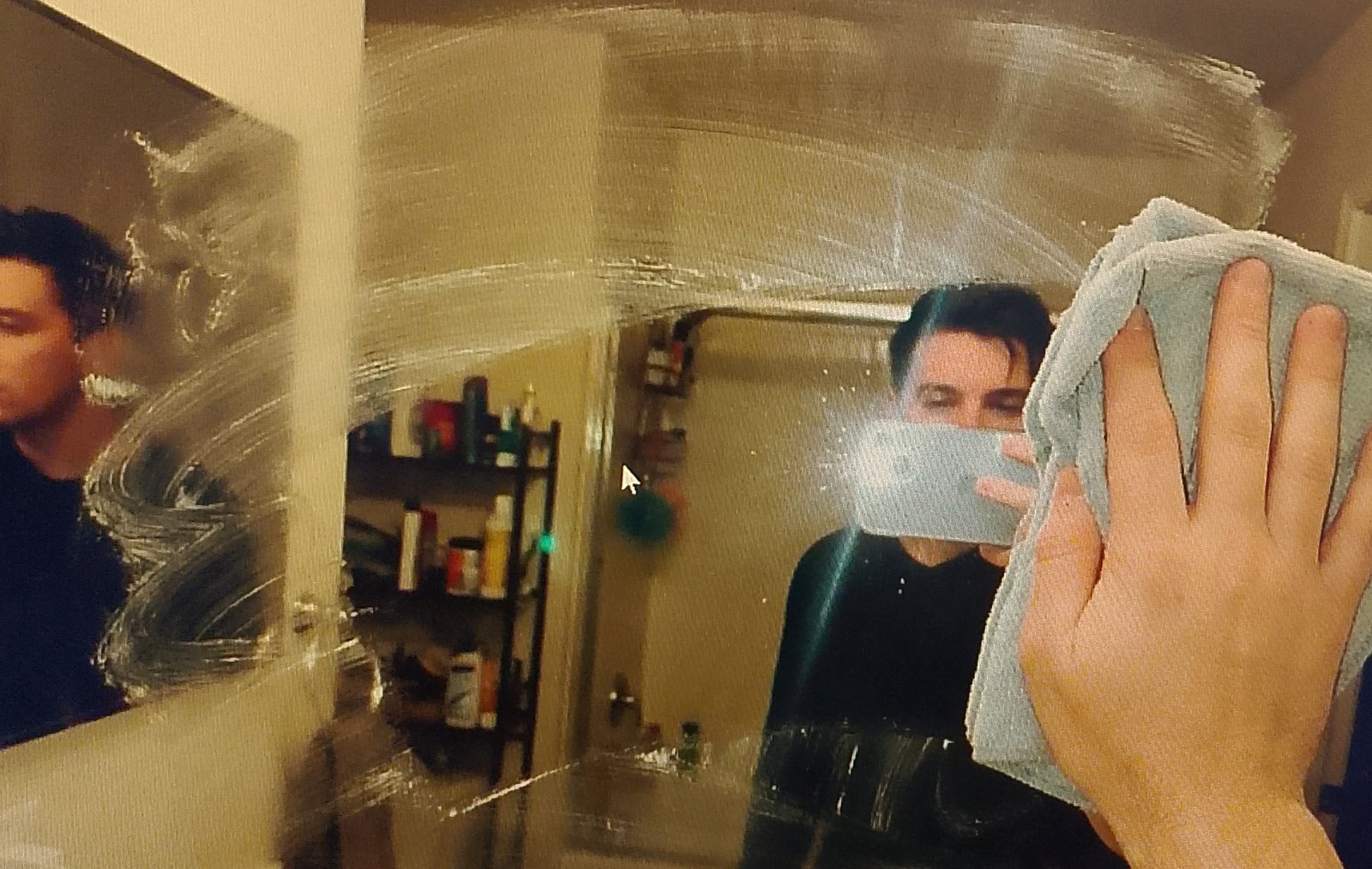 mirror turns quiet Smudged mirror reflecting fingerprints