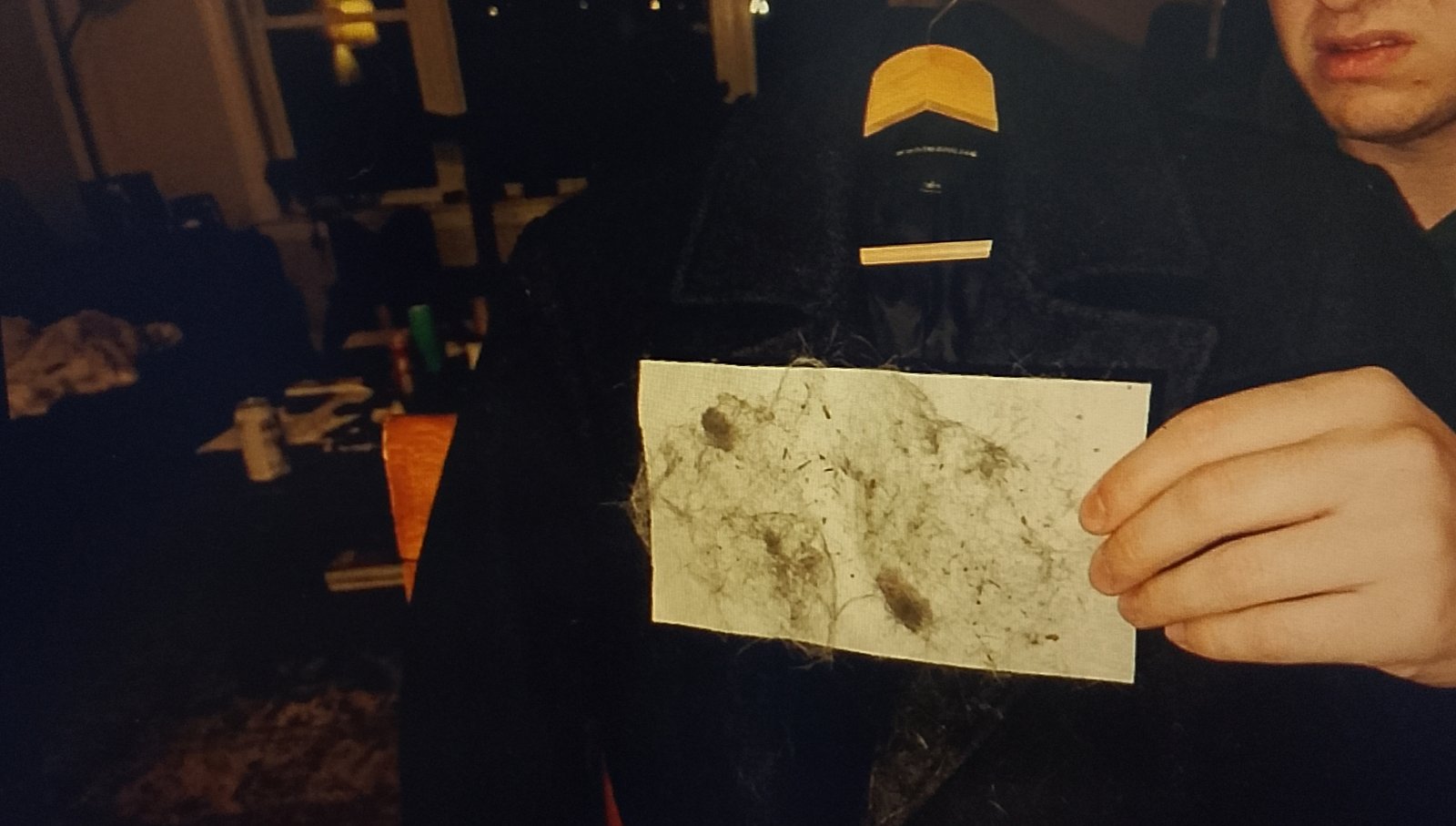 Lint roller showing grey dust from a seemingly clean coat