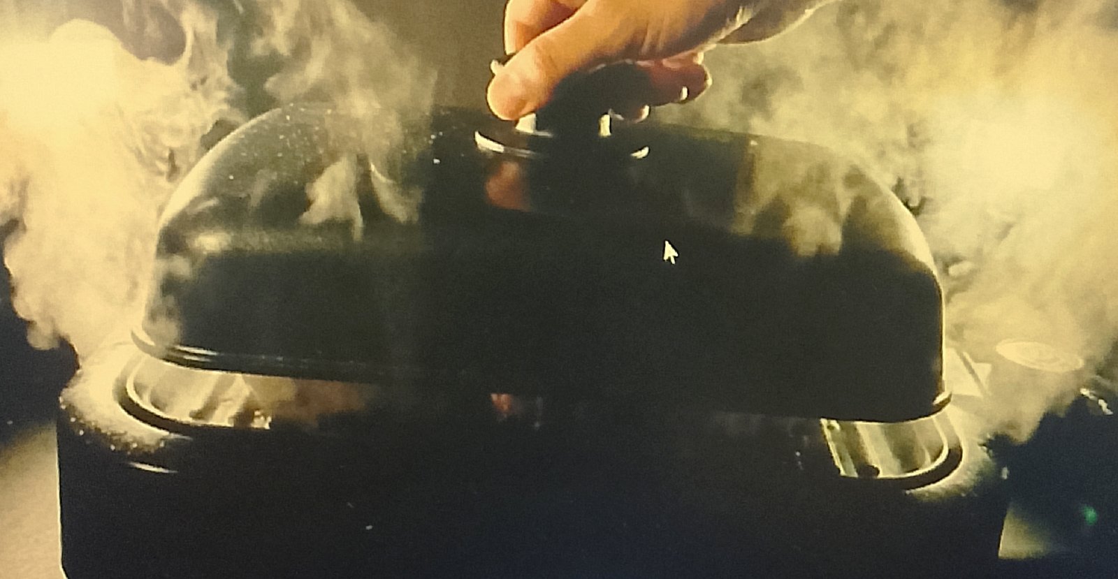 Steam coming out of a George Foreman grill during cleaning