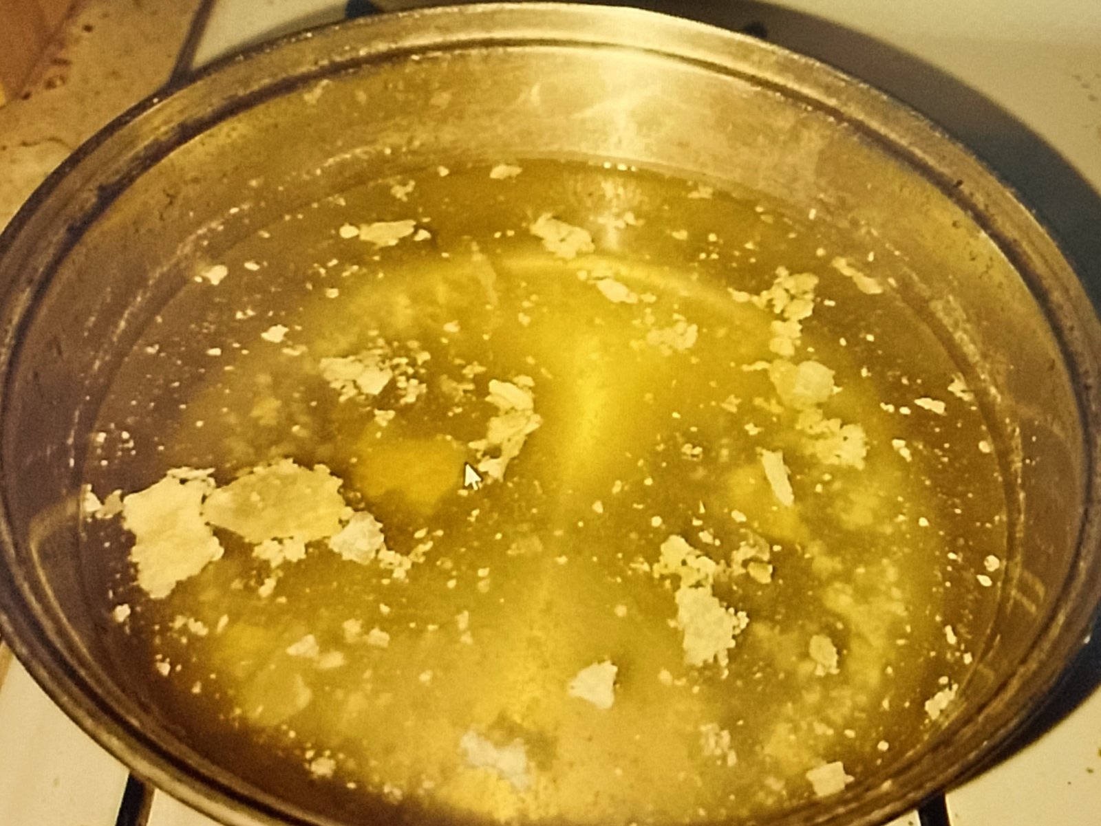 water not clear Cloudy water with white scale flakes in coffee pot