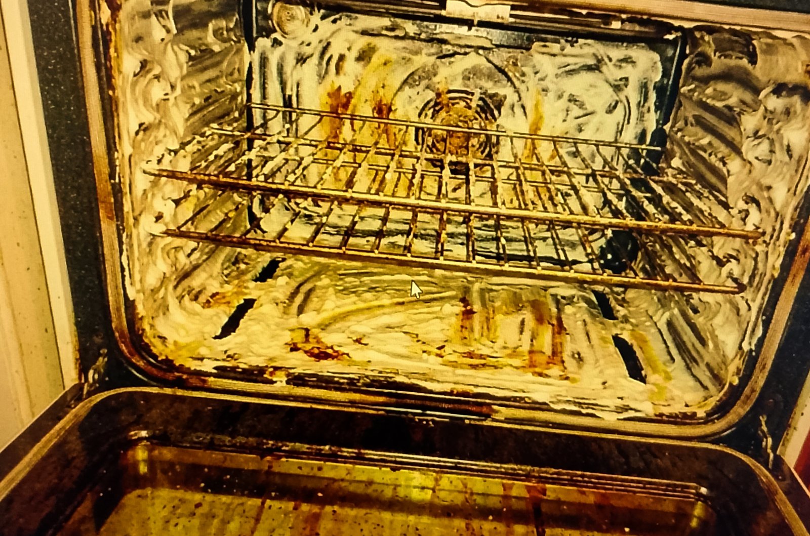 white paste Oven interior coated with white baking soda paste