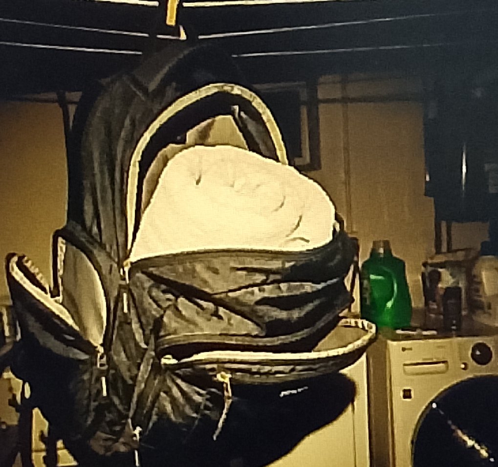 IMG ٢٠٢٦٠١١٤ ١٠٠١٥٧ High Sierra backpack hanging upside down with pockets open while air drying