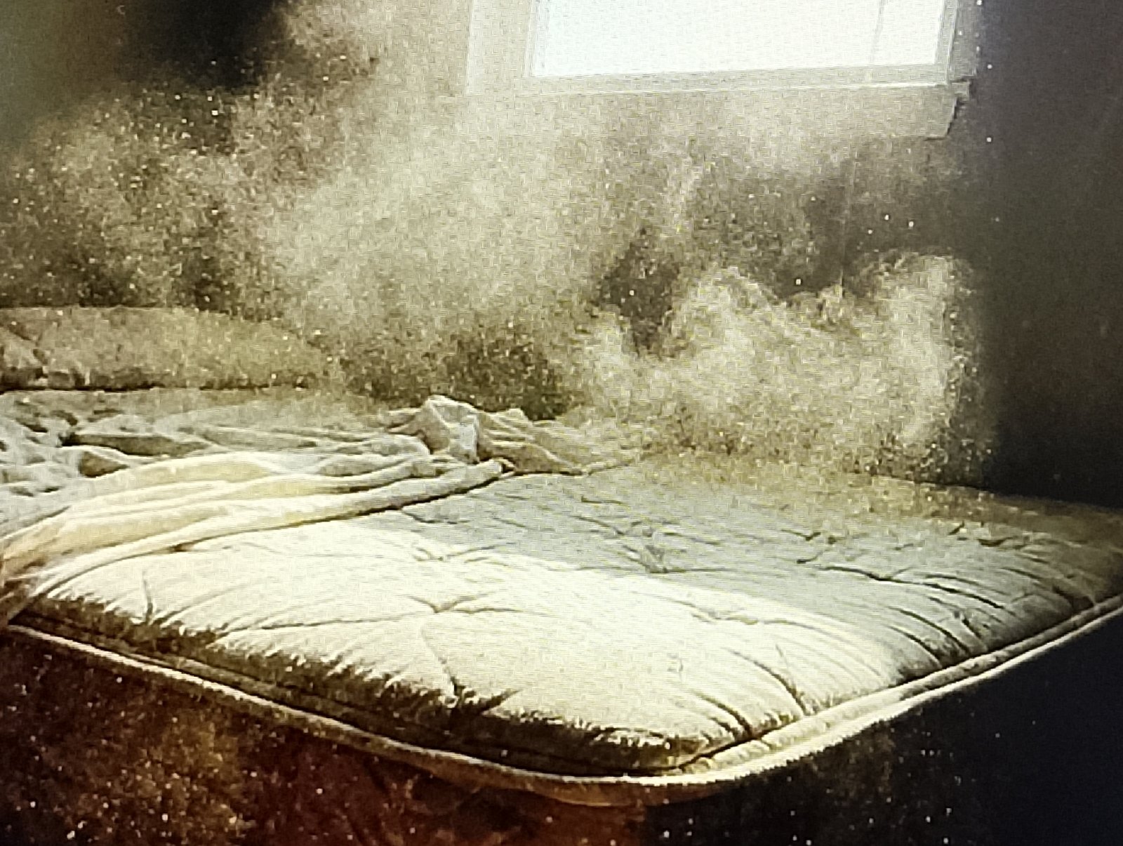 Beating a mattress in the sun to remove dust without a vacuum