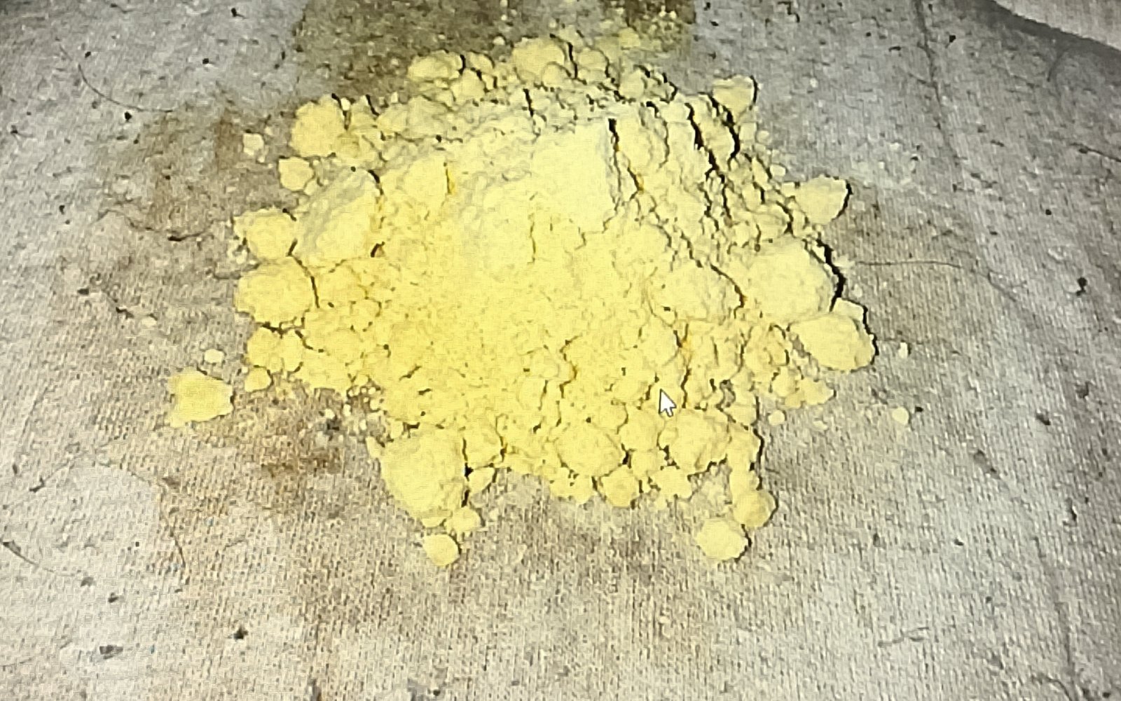 mattress with mound of clumpy Clumpy yellow baking soda on mattress absorbing urine