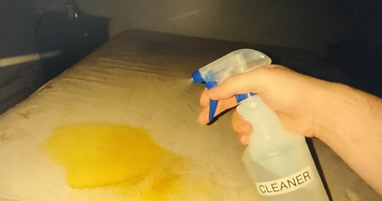 Using a spray bottle to mist cold water on stain