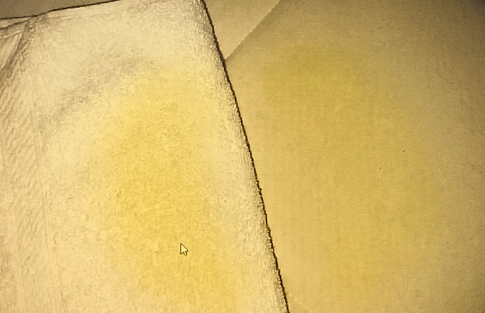 Towel showing yellow stain transfer after blotting