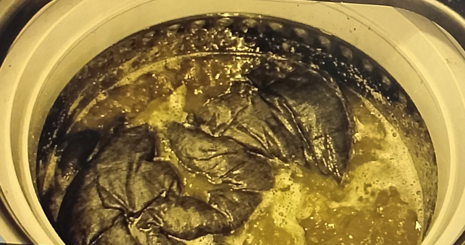 Murky grey water in washing machine cleaning a weighted blanket