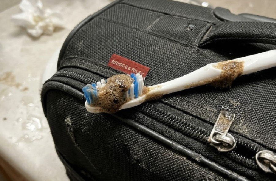 Spot Scrubbing 1 Spot scrubbing ballistic nylon luggage with soapy foam and toothbrush