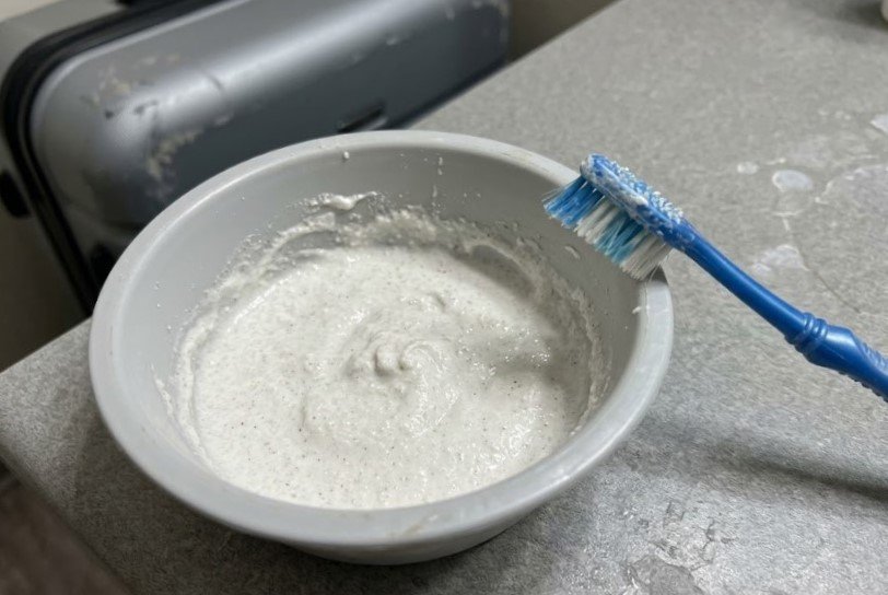 thick white gritty paste sitting in a bowl it thick, white, gritty paste sitting in a bowl