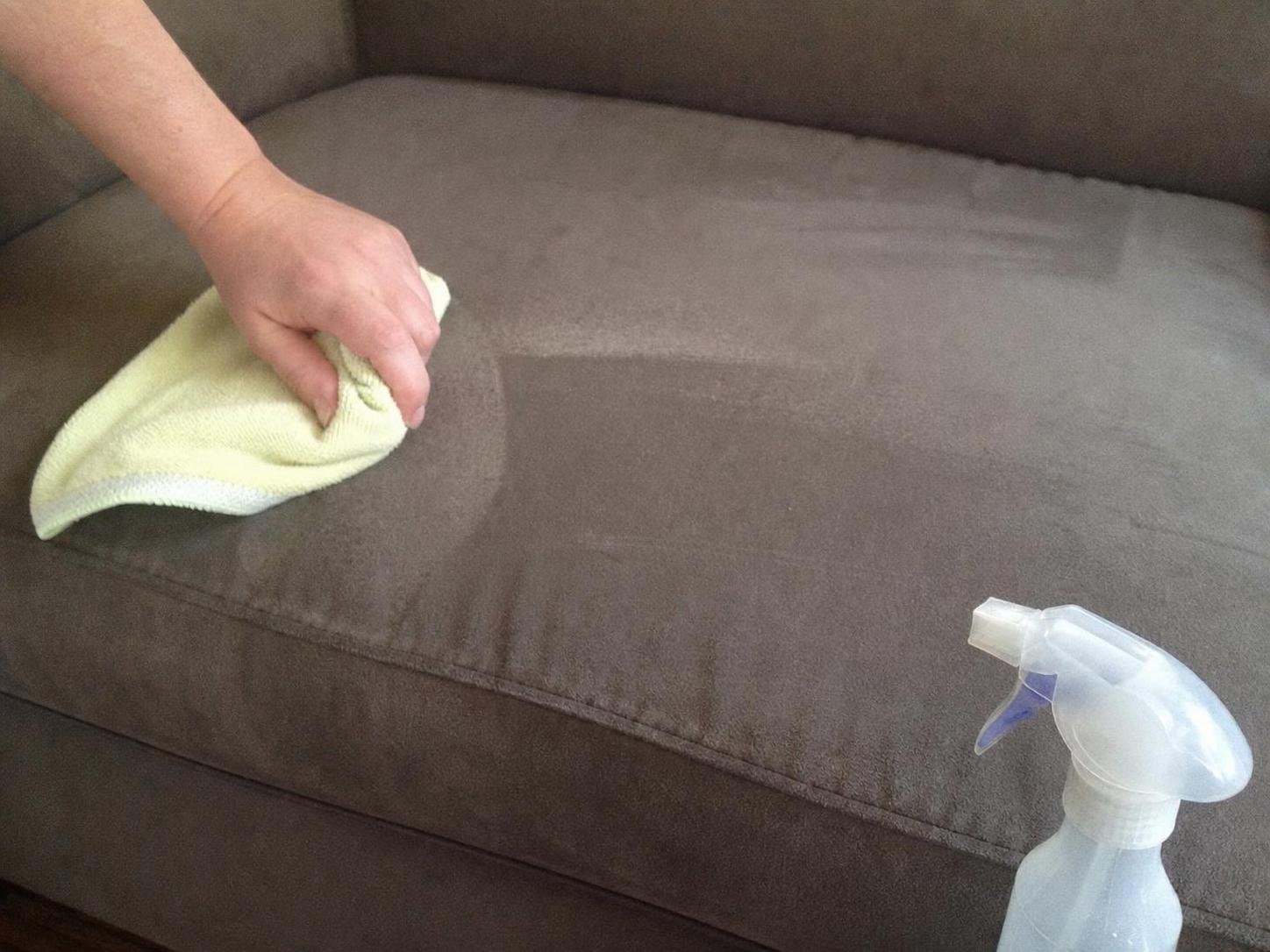 Close-up household cleaning method for how to clean a microfiber couch without water marks; best way to clean a microfiber couch without water marks; clean a microfiber couch without water marks without damage; safe cleaner for a microfiber couch without water marks; a microfiber couch without water marks cleaning mistakes; how often to clean a microfiber couch without water marks