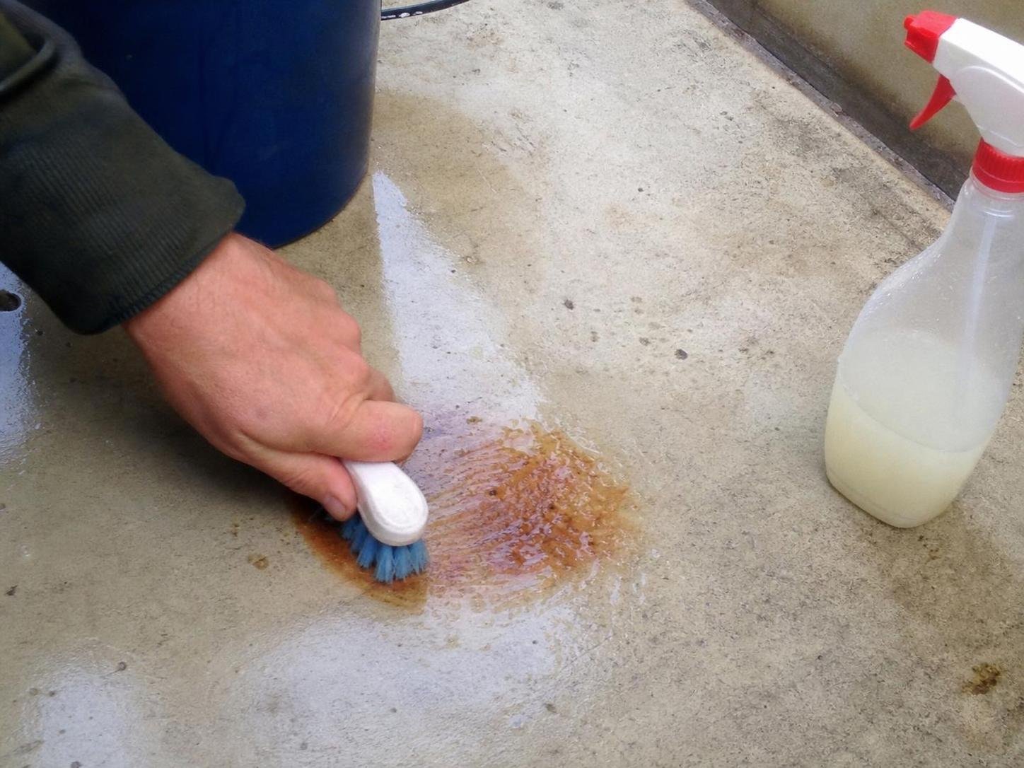 Close-up household cleaning method for how to remove rust stains from concrete; best way to remove rust stains from concrete; remove rust stains from concrete without damage; safe cleaner for rust stains from concrete; how to prevent rust stains from concrete; rust stains from concrete cleaning mistakes