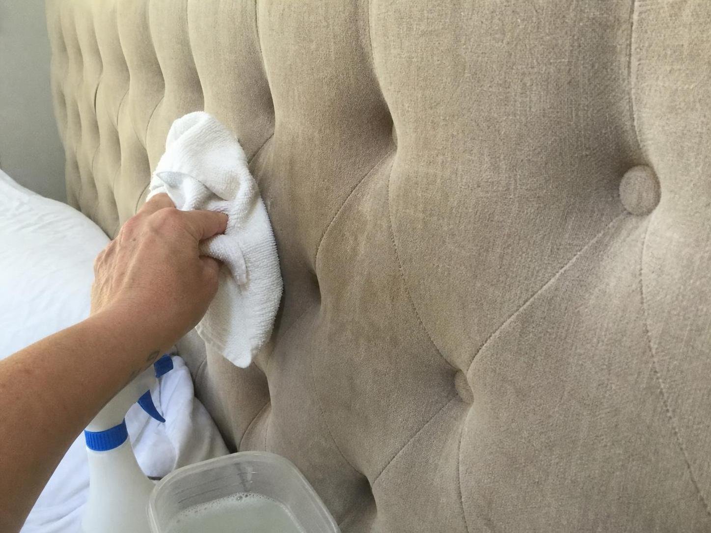 Close-up household cleaning method for how to clean an upholstered headboard; best way to clean an upholstered headboard; clean an upholstered headboard without damage; safe cleaner for an upholstered headboard; an upholstered headboard cleaning mistakes; how often to clean an upholstered headboard
